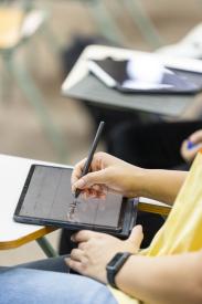 student taking notes in class 