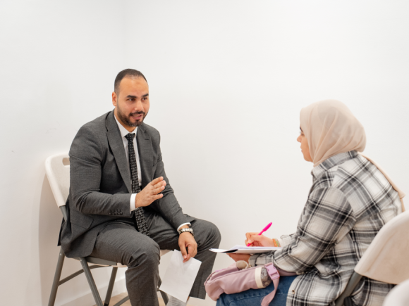 student talking to facilitator